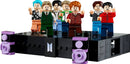 LEGO Ideas 21339 BTS Dynamite minifigures on a stage with speakers, celebrating the pop icons of BTS.