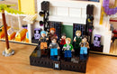 LEGO Ideas BTS Dynamite set featuring minifigures RM, Jin, SUGA, j-hope, Jimin, V, and Jung Kook on stage.